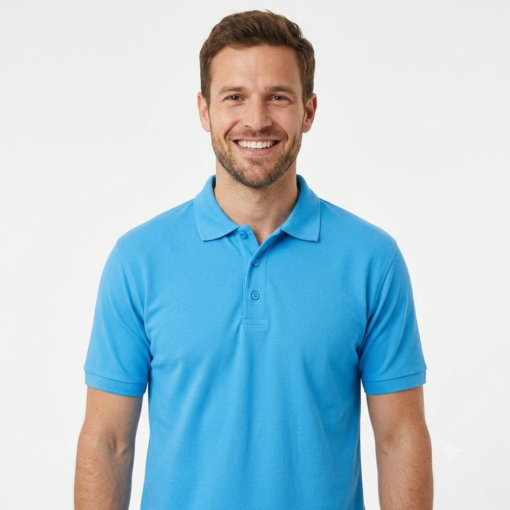 A smiling man wearing a bright blue short-sleeve polo shirt, photographed against a clean white studio background.